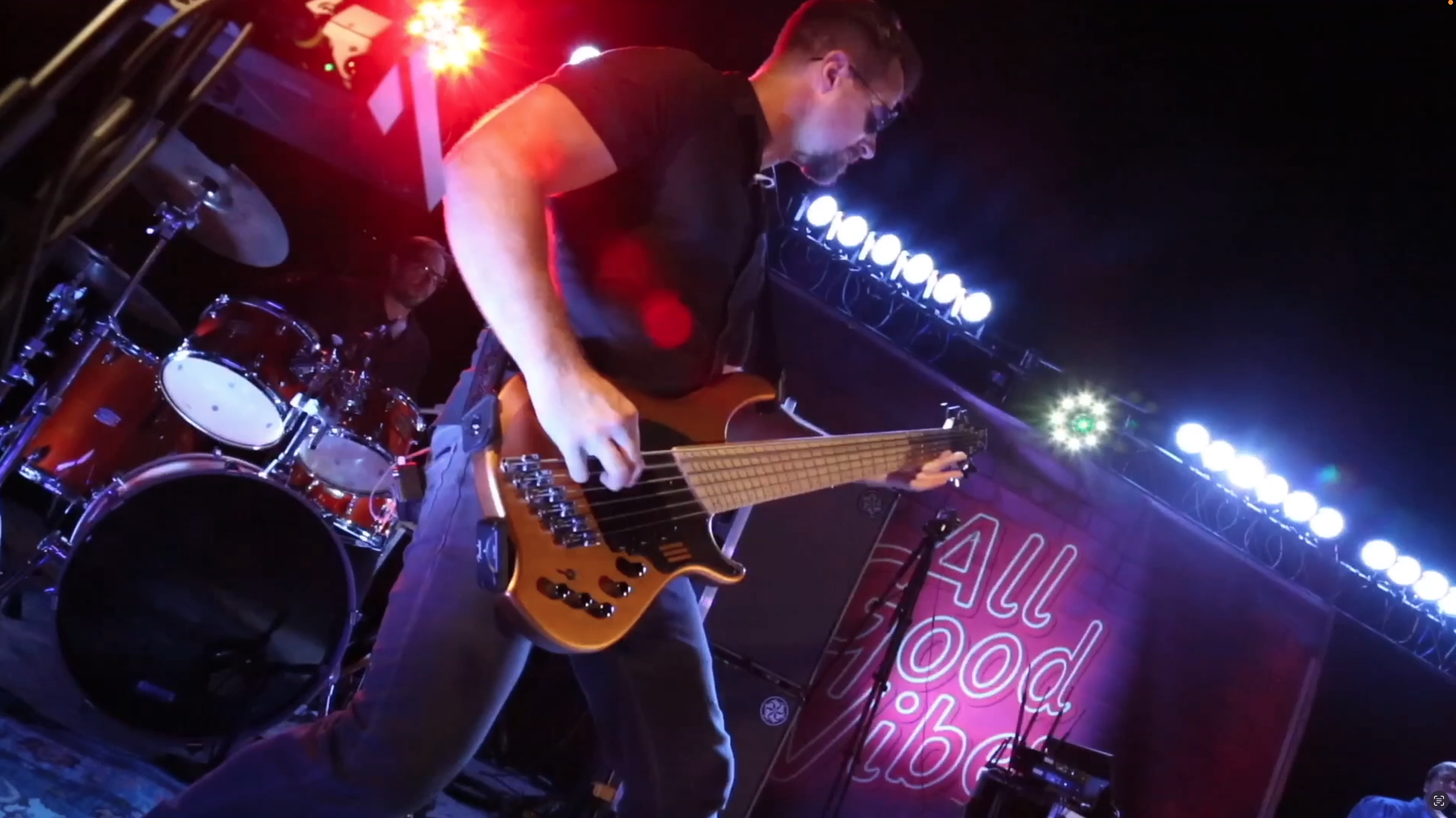 Dustin of All Good Vibes performing live on bass guitar