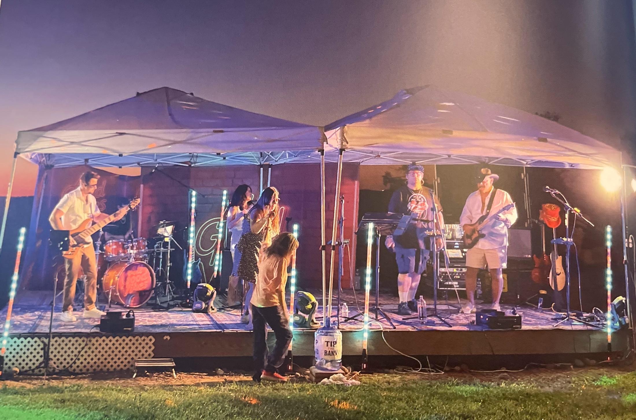 All Good Vibes performing live on the outdoor Amber Ranch stage at night