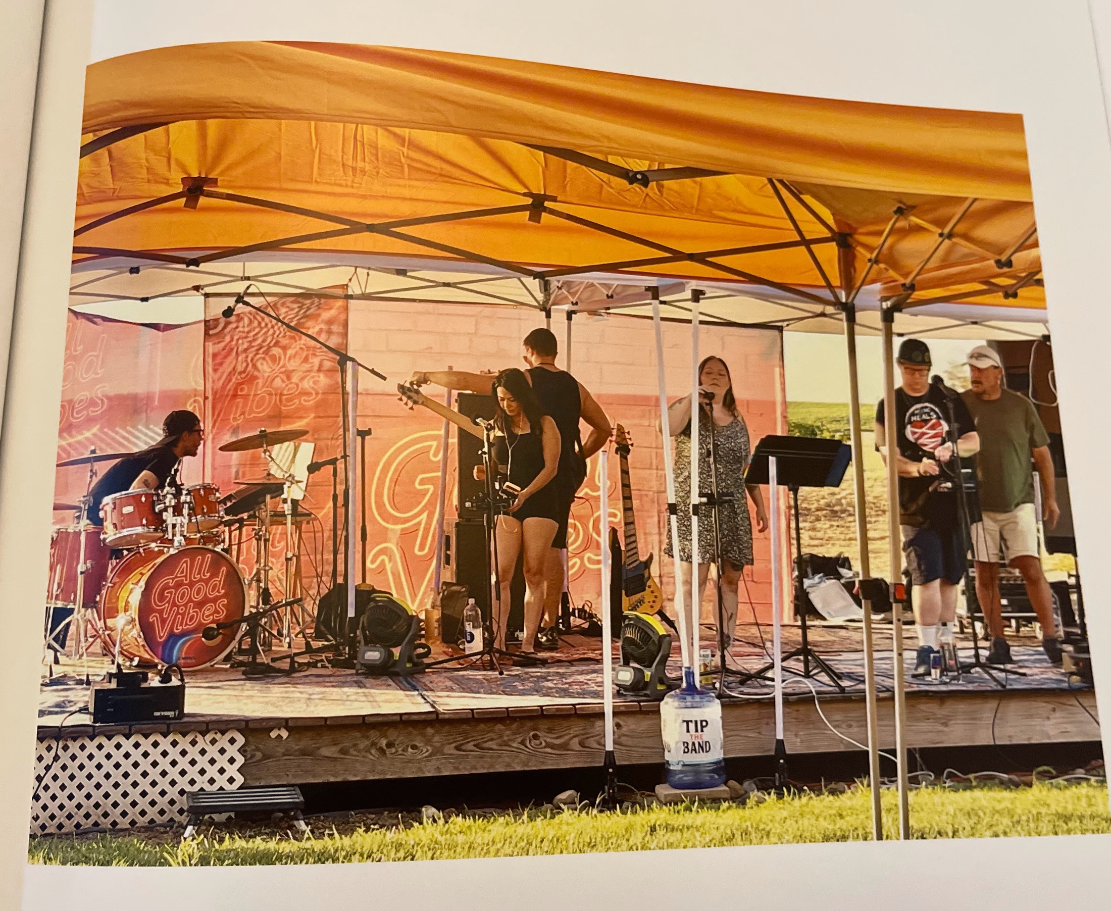 The live band performing beneath a canopy at Amber Ranch