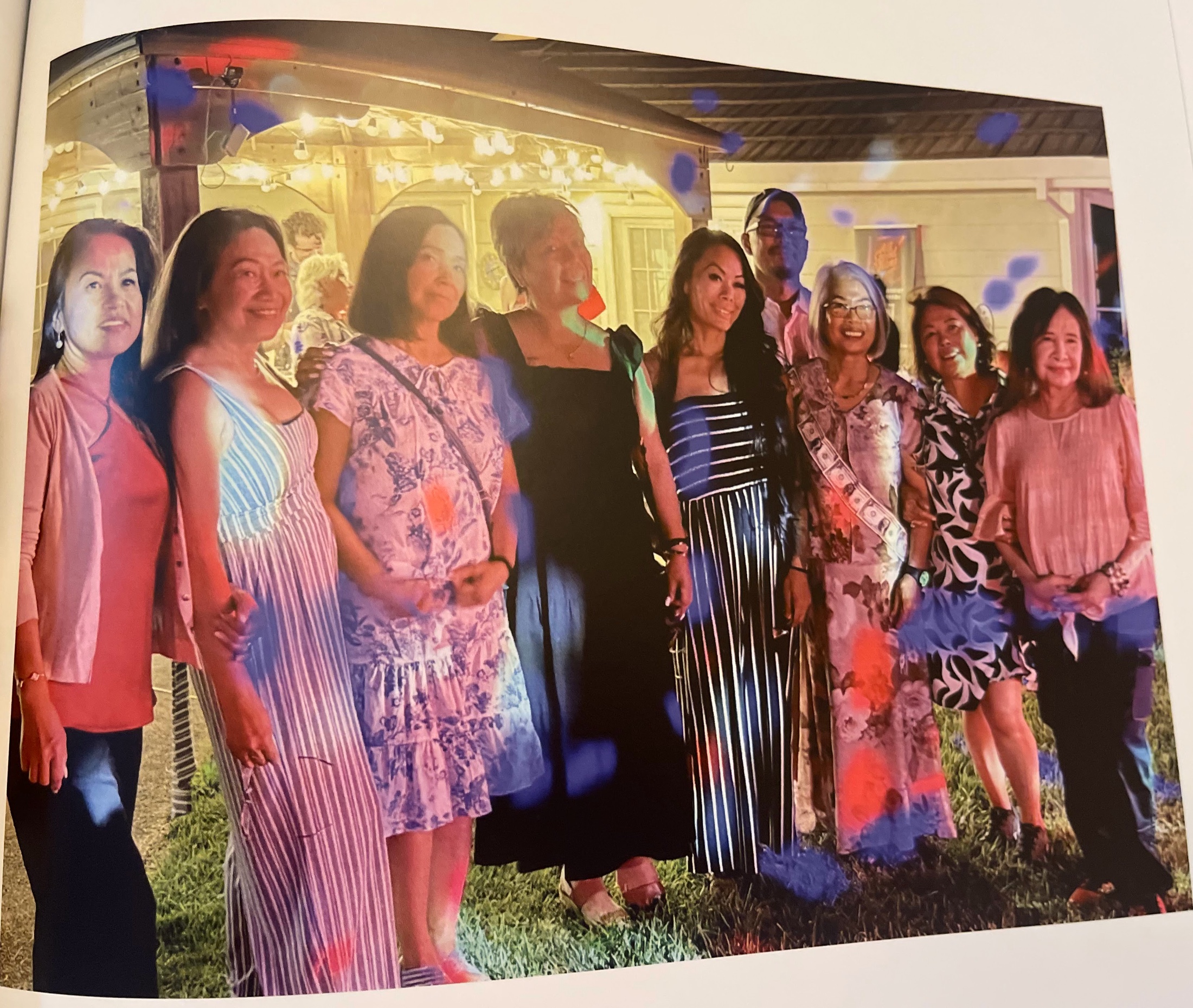 A large group of guests smiling together at an Amber Ranch celebration